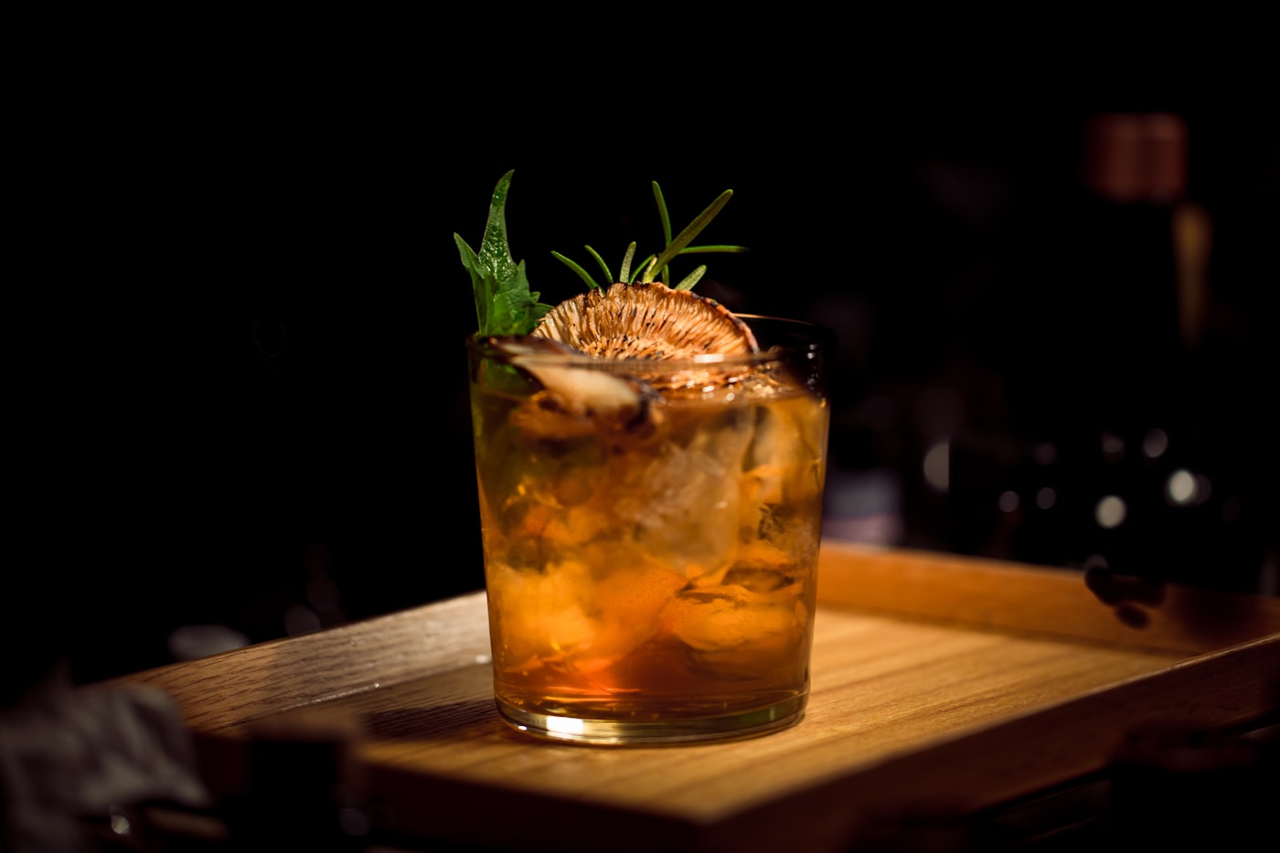 An amber cocktail with a touch of hot honey
