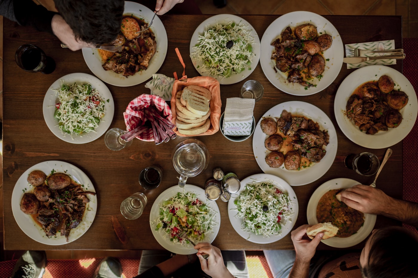 A shared table of dishes at Helm and Honey